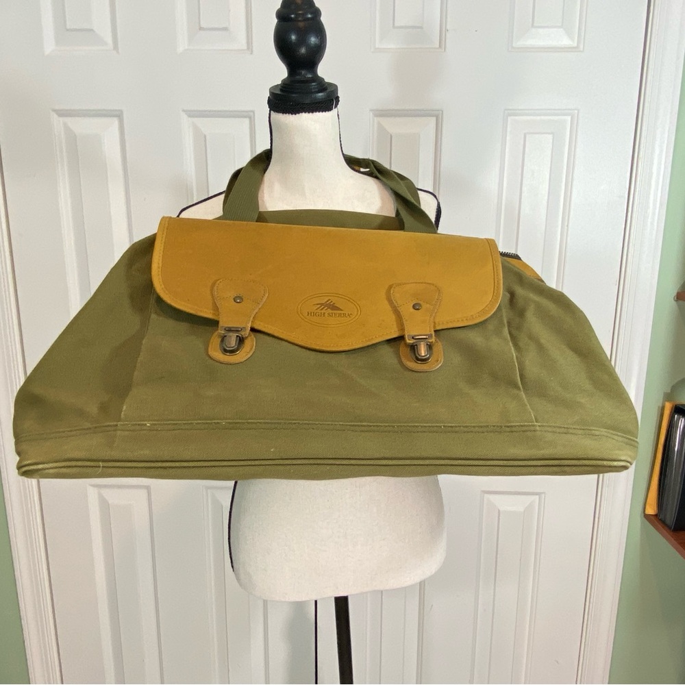 Vintage like new High Sierra leather and green canvas duffle bag.